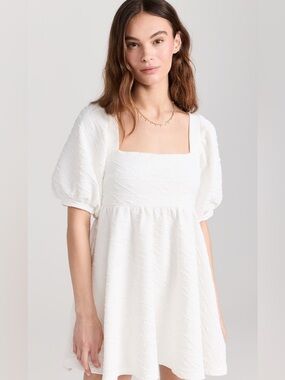 NWT Free People Violet Mini Dress in a white color.